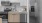 kitchen area with stainless steel appliances and white upper cabinets