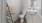 bathroom with a mirror, sink and toilet